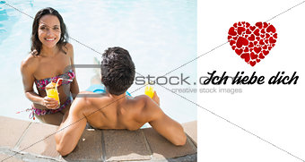 Composite image of attractive couple drinking cocktails in the pool