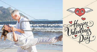 Composite image of happy couple dancing on the beach together