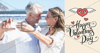 Composite image of married couple at the beach together taking a selfie
