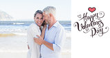 Composite image of happy couple hugging on the beach woman looking at camera