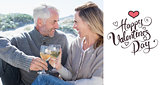 Composite image of couple enjoying white wine on picnic at the beach