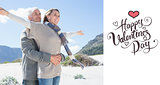 Composite image of carefree couple hugging on the beach in warm clothing