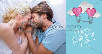 Composite image of cute couple relaxing on bed smiling at each other