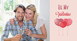 Composite image of cute smiling couple enjoying white wine together