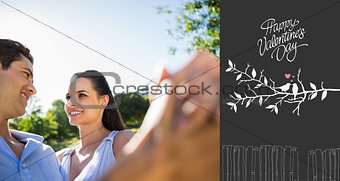 Composite image of loving and happy couple dancing at park