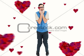Composite image of geeky hipster looking nervously at camera