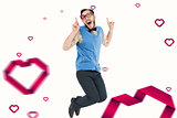 Composite image of geeky hipster jumping and smiling
