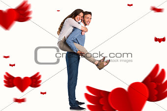 Composite image of portrait of smiling man carrying woman