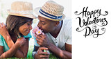Composite image of happy couple lying in garden together smelling flowers