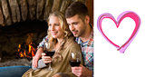 Composite image of couple with wineglasses in front of lit fireplace