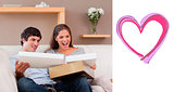 Composite image of couple on the couch opening parcel