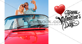 Composite image of smiling couple standing in red cabriolet taking picture