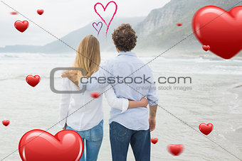 Composite image of rear view of a couple looking at sea