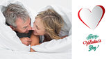 Composite image of loving middle aged couple under the duvet