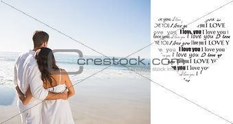 Composite image of content couple looking at the sea