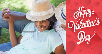 Composite image of smiling couple relaxing in their garden