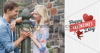 Composite image of hip young couple smiling at each other by railings