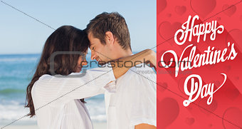 Composite image of couple embracing each other on the beach