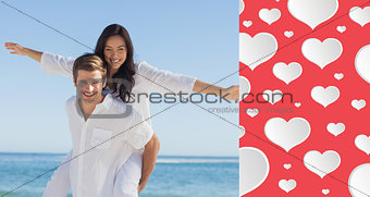 Composite image of woman sitting on mans back smiling at camera