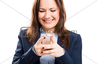 Business woman with a cellphone texting
