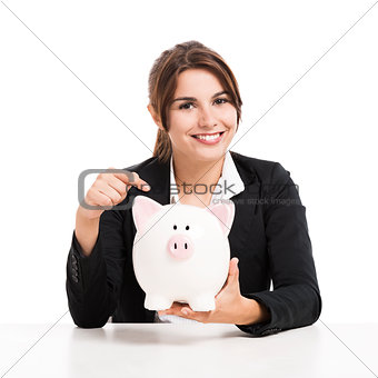 Businesswoman with a piggy bank