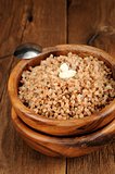 Russian buckwheat kasha in wooden bowl
