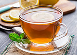 Cup of tea with mint and lemon