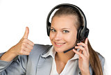 Businesswoman in headset showing thumb up