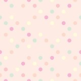 Tile pastel vector pattern with colorful polka dots on pink background