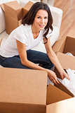 Single Woman Unpacking Packing Boxes Moving House