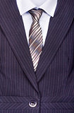 Close up of businessman wearing a tie, shirt, and suit