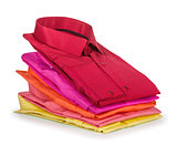 stack of colored shirt on a white background