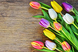 bouquet of colorful tulips over rustic wooden