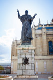 Pope John Paul II statue and Cathedral Almudena on a spring day 