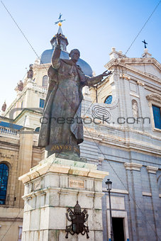 Pope John Paul II statue in front of Cathedral Almudena on a spr