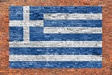 Flag of Greece painted over brick wall