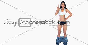 Smart woman wearing jeans falling down because shes lost weight