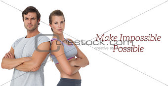 Portrait of a sporty couple with arms crossed