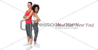 Portrait of two fit young women with arms crossed