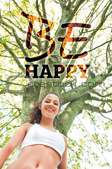 Composite image of active happy brunette smiling at camera