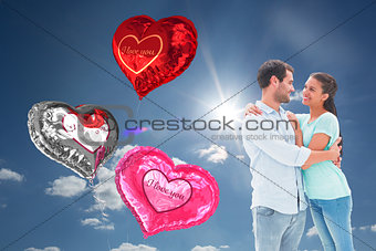 Composite image of attractive young couple hugging each other