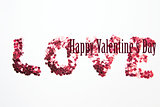 Composite image of pink confetti spelling out love