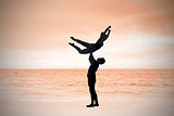 Composite image of ballet partners dancing gracefully together