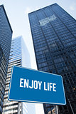 Enjoy life against low angle view of skyscrapers
