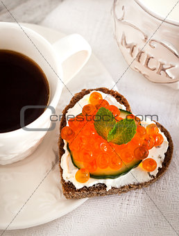 Romantic breakfast-toasts  with red caviar and coffee