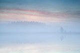 misty sunrise over lake