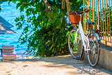 white bicycle parked near the sea