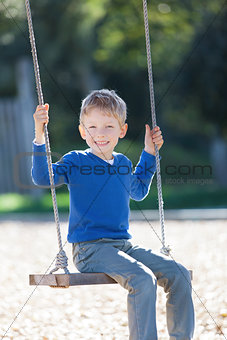 boy at swings