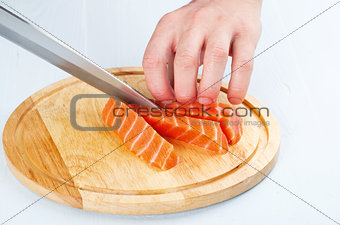 the process of cutting salmon