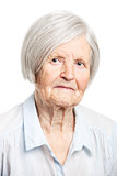 Portrait of a senior woman looking at the camera. Over white background.